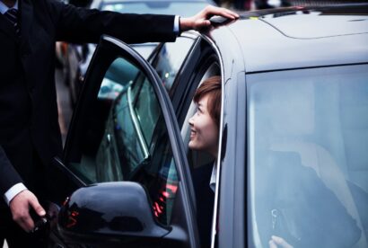 businessman-opening-car-door-for-businesswoman-dur-2024-10-23-08-32-05-utc-1