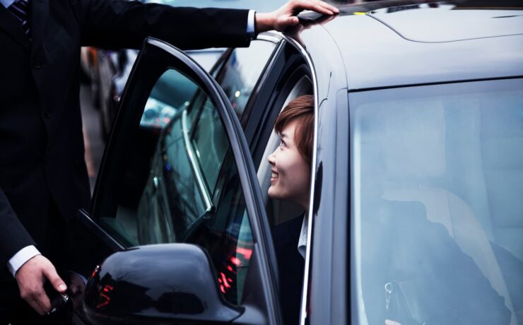 businessman-opening-car-door-for-businesswoman-dur-2024-10-23-08-32-05-utc-1